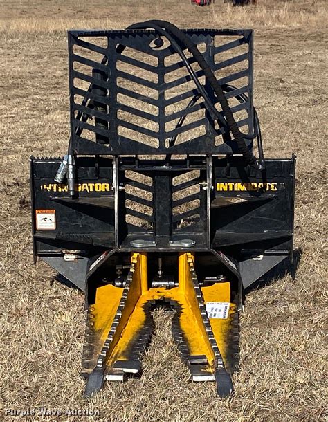 skid steer intimidator|skid steer tree remover.